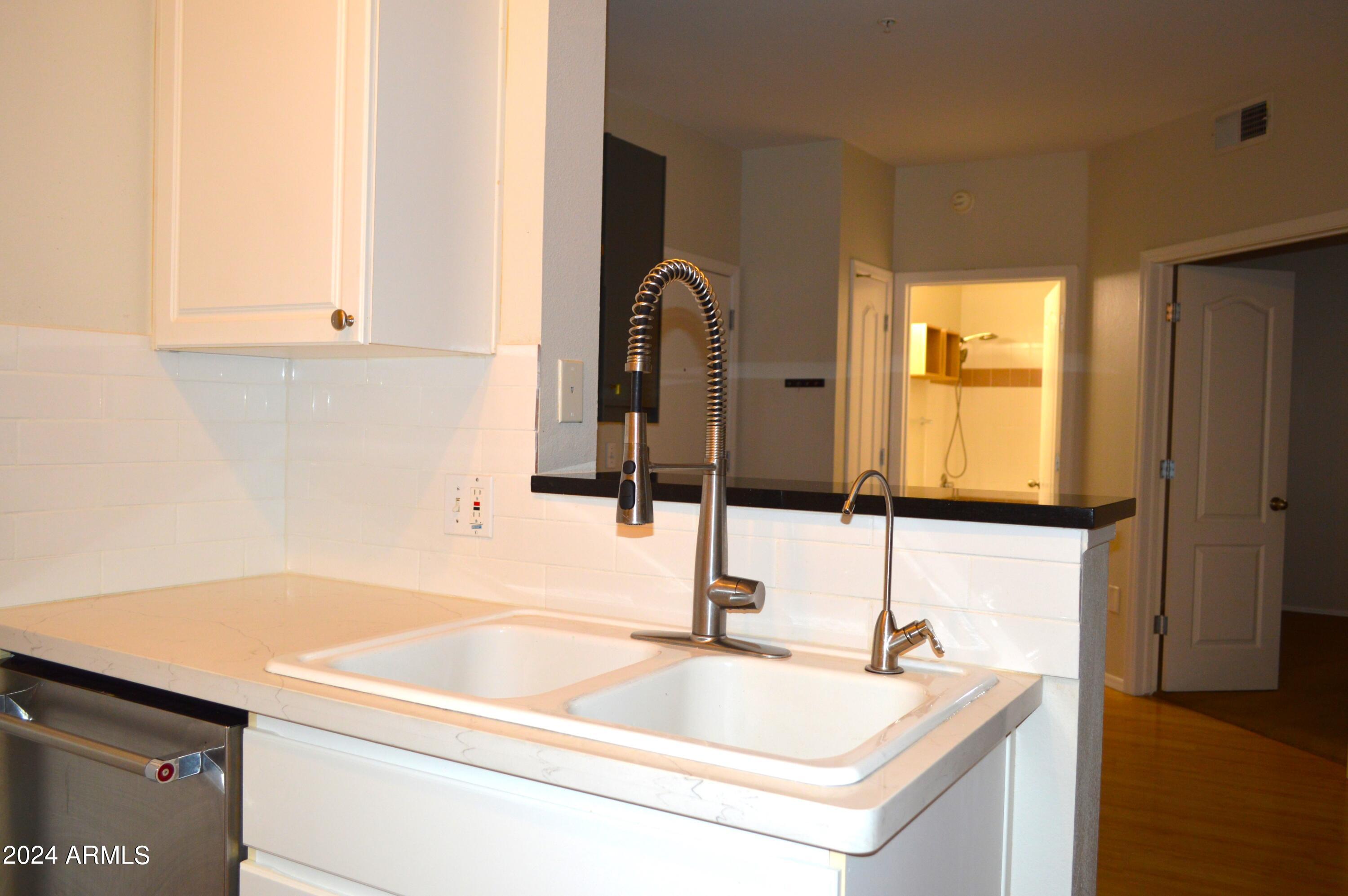 1701 East Colter Street, Unit 263 Phoenix, AZ 85016 - Photo 4 of 65 a bathroom with a sink and a mirror