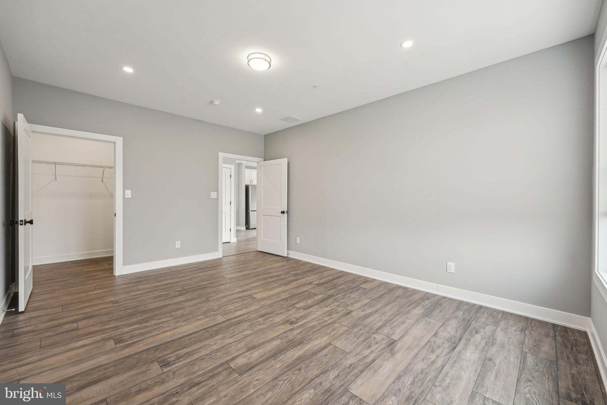 2421 Bristol Road, Unit 2B100 Warrington, PA 18976 - Photo 20 of 50 wooden floor in an empty room with wooden floor