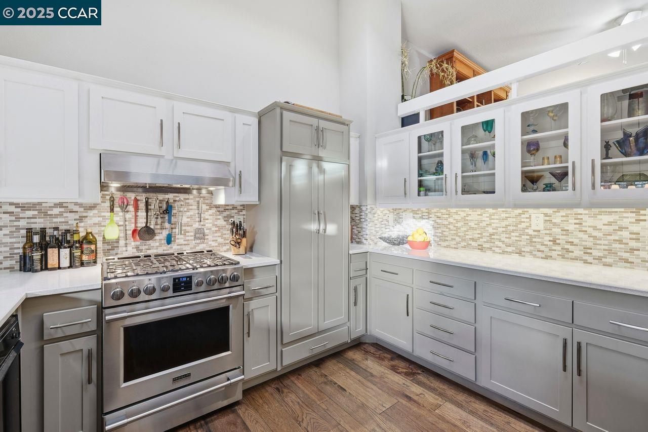 533 Monarch Ridge Drive Walnut Creek, CA 94597 - Photo 11 of 43 a kitchen with stainless steel appliances granite countertop a stove and a refrigerator