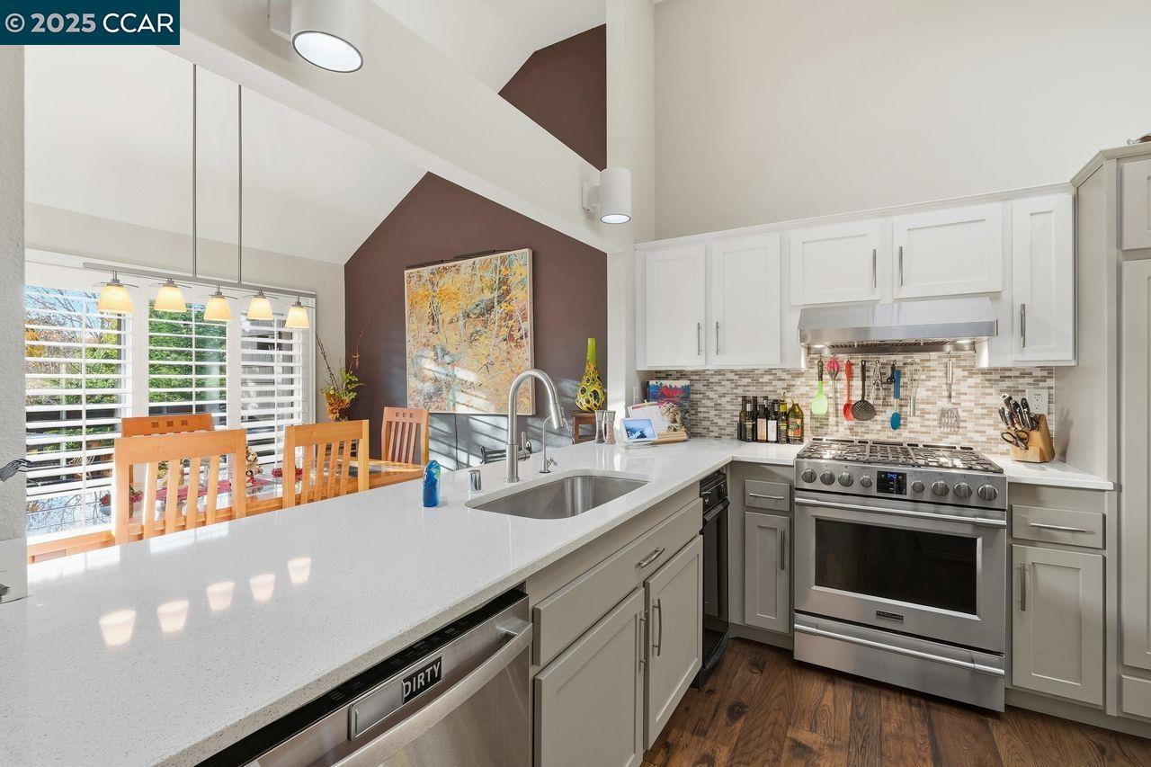 533 Monarch Ridge Drive Walnut Creek, CA 94597 - Photo 12 of 43 a kitchen with a sink stove and cabinets