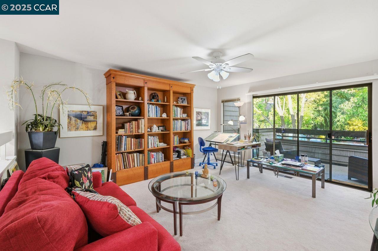 533 Monarch Ridge Drive Walnut Creek, CA 94597 - Photo 18 of 43 a living room with furniture and a floor to ceiling window