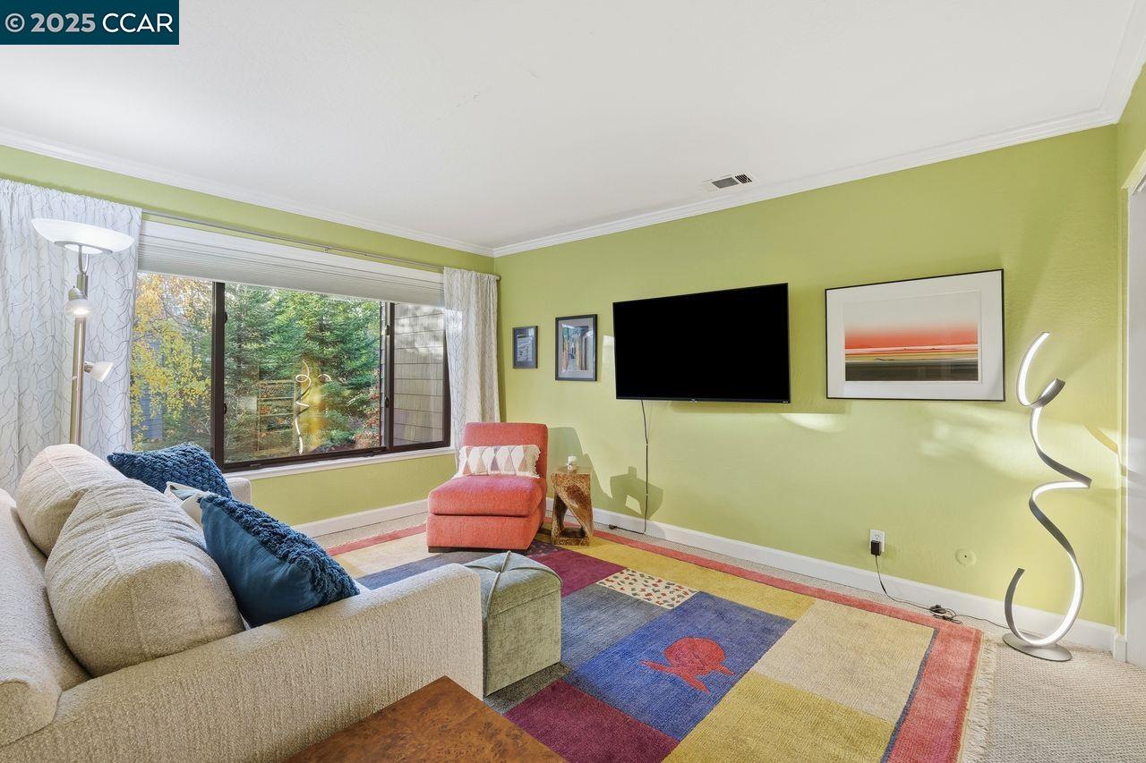 533 Monarch Ridge Drive Walnut Creek, CA 94597 - Photo 27 of 43 a living room with furniture and a flat screen tv