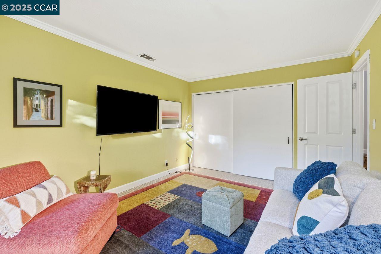 533 Monarch Ridge Drive Walnut Creek, CA 94597 - Photo 28 of 43 a living room with furniture and a flat screen tv