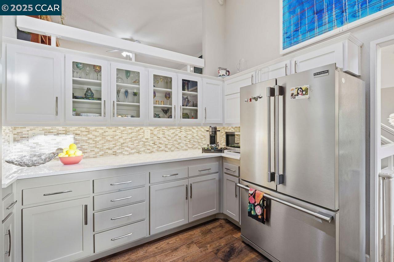 533 Monarch Ridge Drive Walnut Creek, CA 94597 - Photo 10 of 43 a kitchen with a refrigerator and a sink