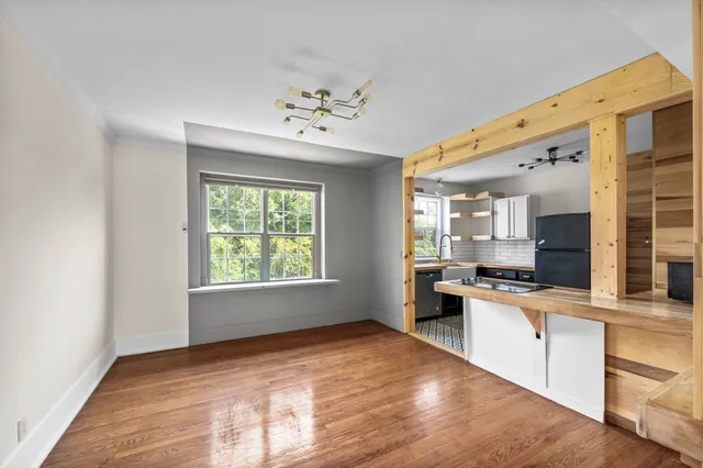 a kitchen with stainless steel appliances granite countertop a stove and cabinets