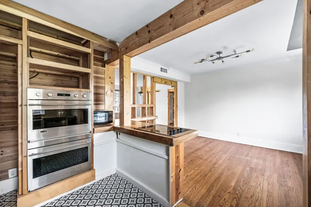 a kitchen with a stove and a microwave