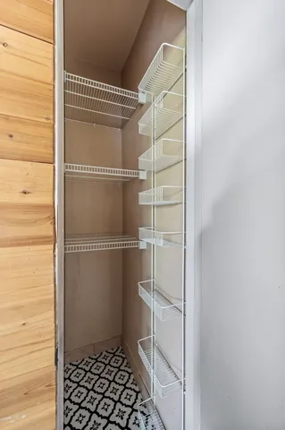 a bathroom with a glass door shower