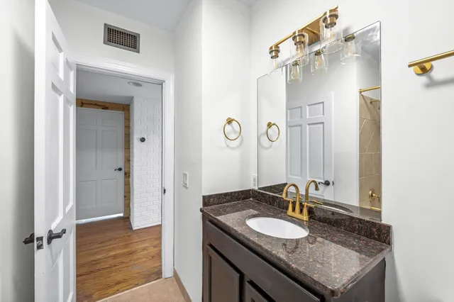 a bathroom with a tub and a shower