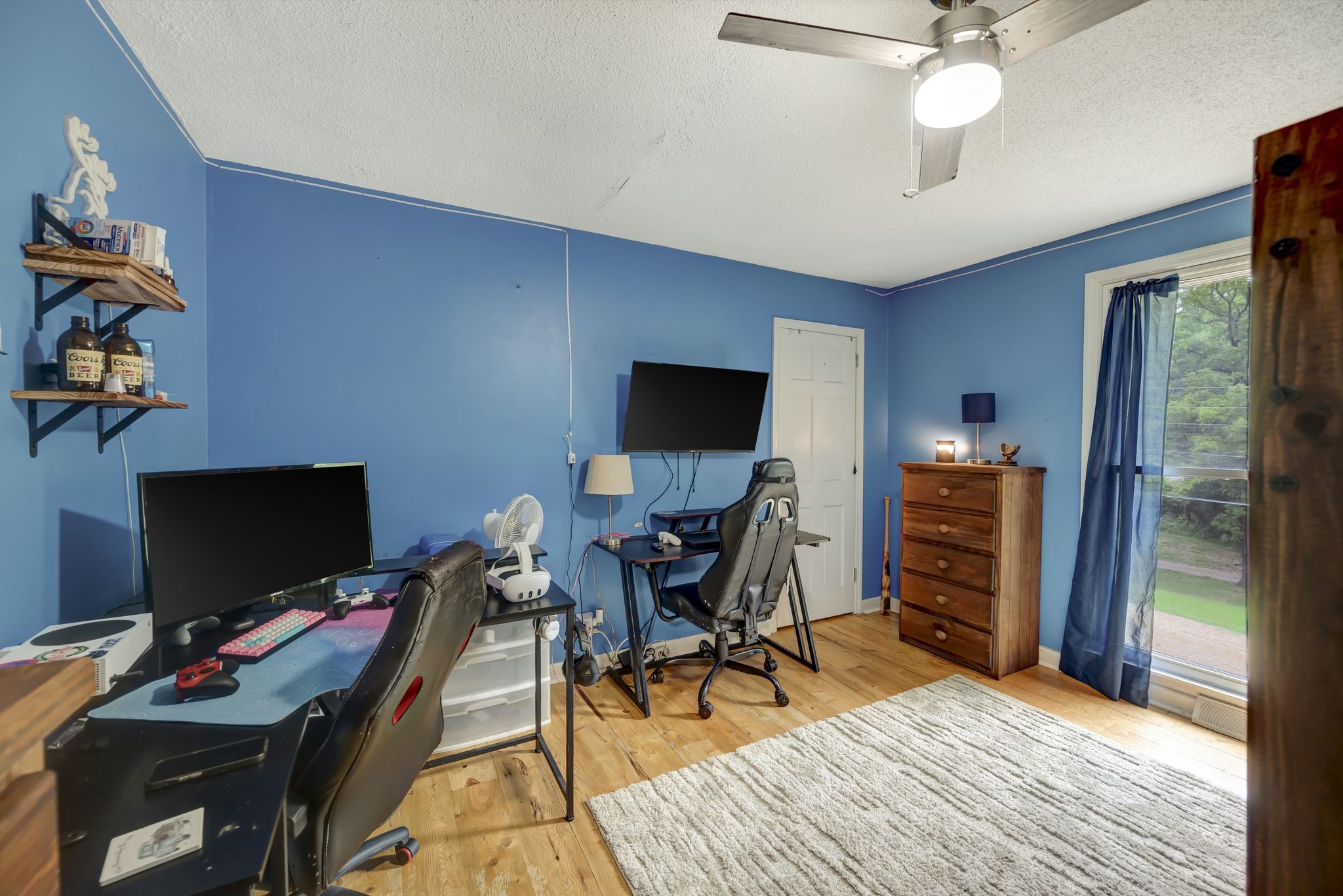6125 Highway 41 A Pleasant View, TN 37146 - Photo 13 of 32 a view of a workspace with furniture and a flat screen tv