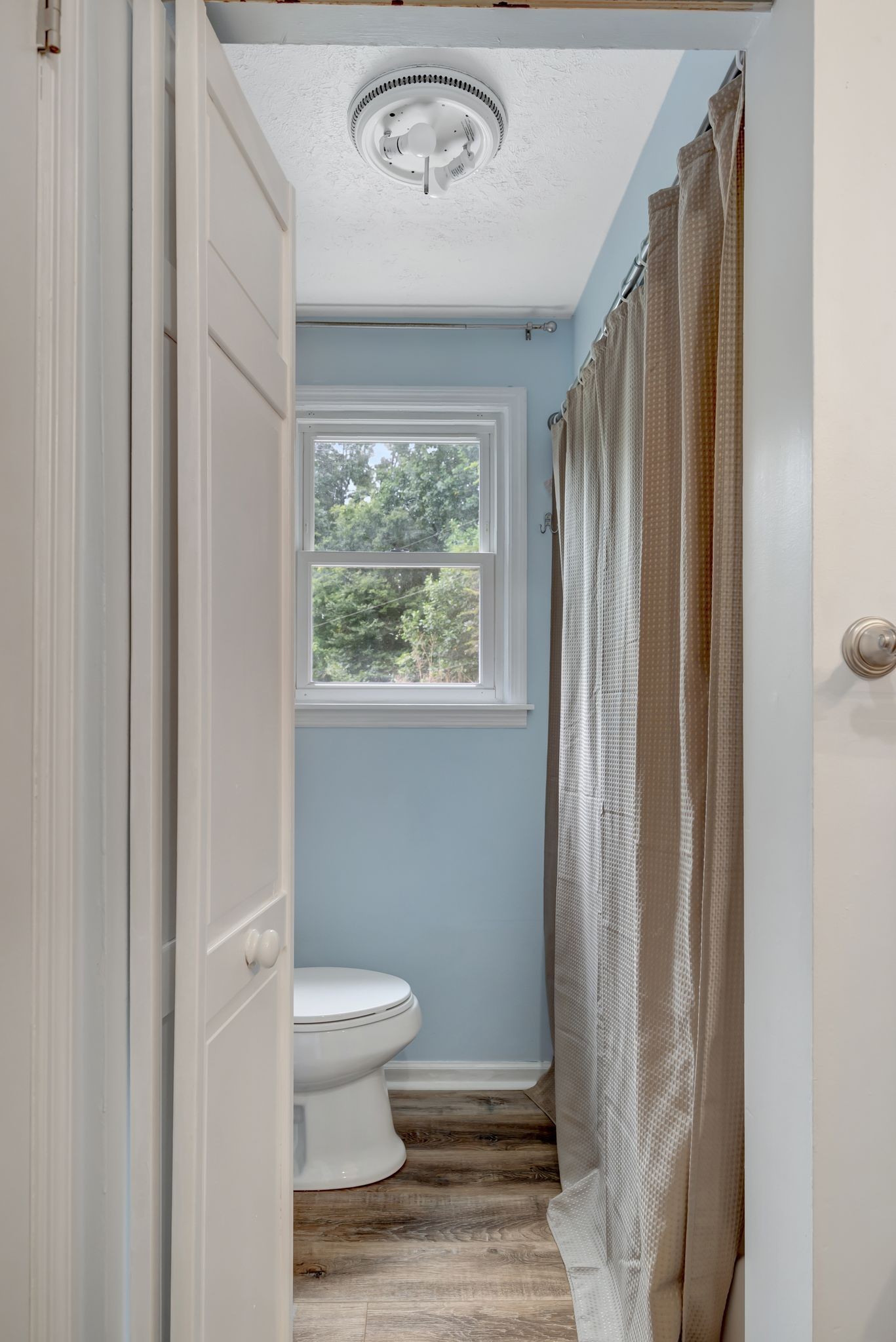 6125 Highway 41 A Pleasant View, TN 37146 - Photo 16 of 32 a bathroom with a toilet a sink and a window