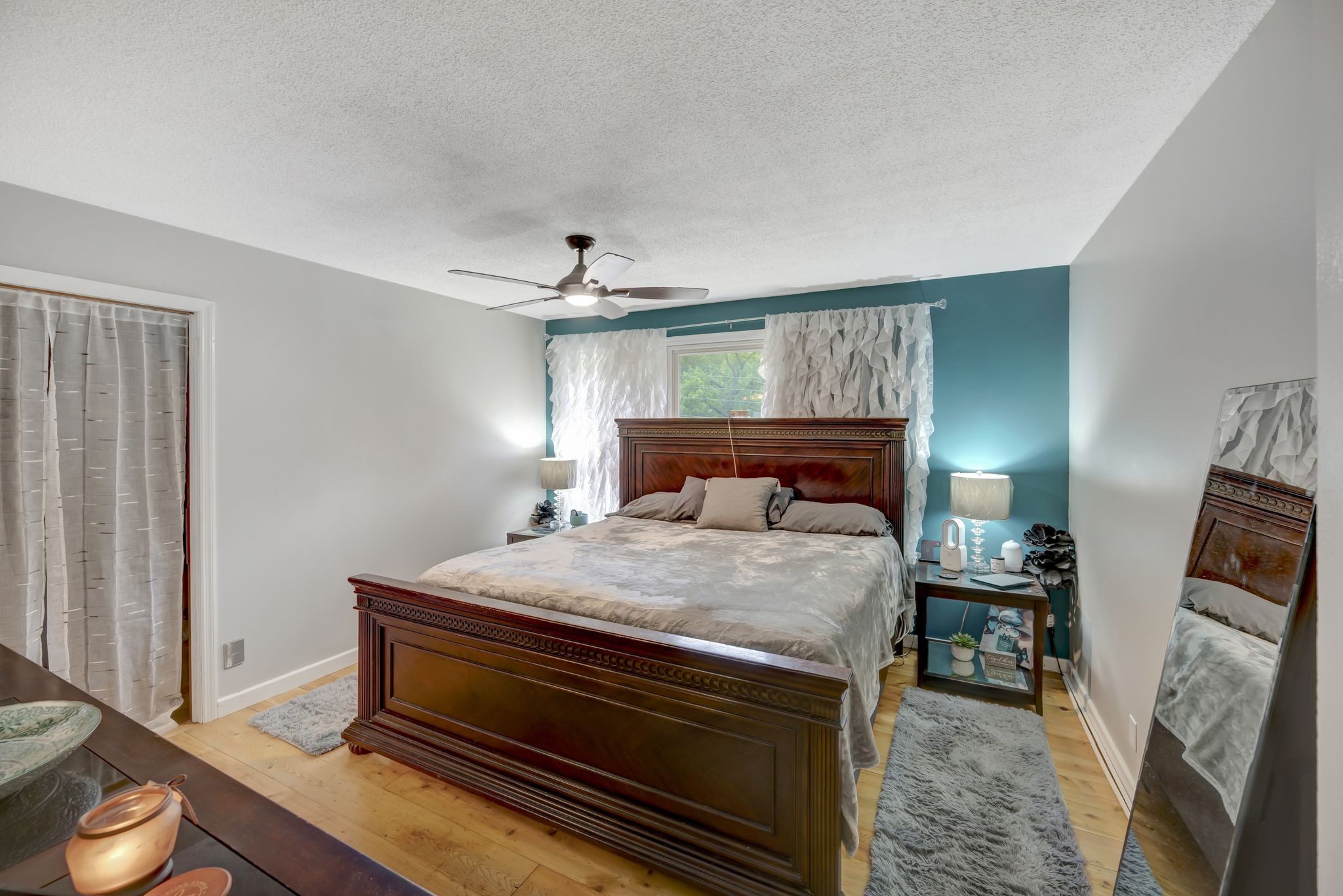 6125 Highway 41 A Pleasant View, TN 37146 - Photo 17 of 32 a bedroom with a bed and a mirror on the dresser