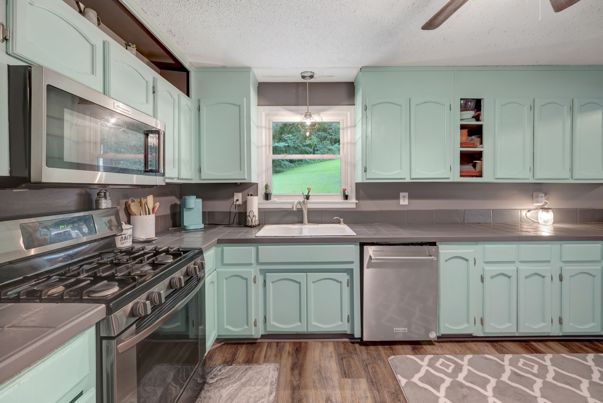 6125 Highway 41 A Pleasant View, TN 37146 - Photo 8 of 32 a kitchen with a sink stove top oven and cabinets