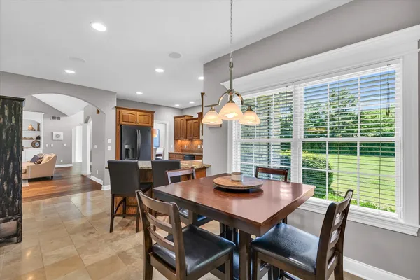 a view of a dining room with furniture window and outside view