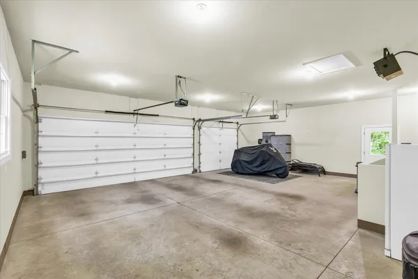 a front view of a house with a yard and green space