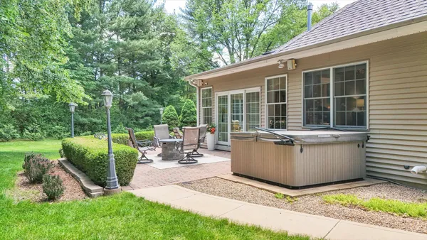 a view of a backyard with garden and patio