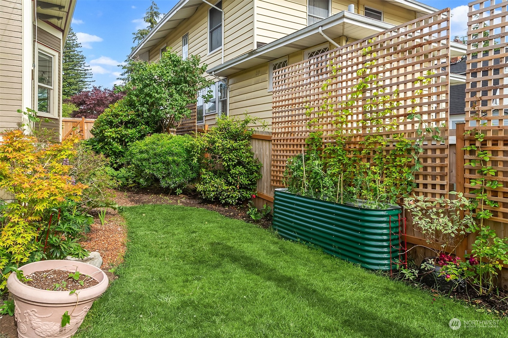 2510 Baker Avenue Everett, WA 98201 - Photo 36 of 37 a view of a backyard with plants and garden