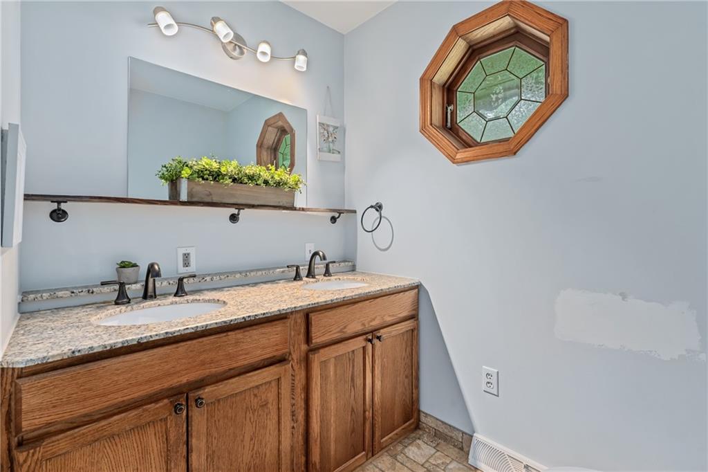 144 Church Road Rural Valley, PA 16249 - Photo 18 of 33 a bathroom with a granite countertop sink a vanity and a mirror