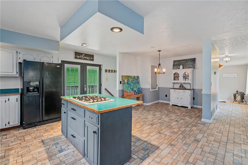 144 Church Road Rural Valley, PA 16249 - Photo 21 of 33 a kitchen with kitchen island a sink stove and refrigerator