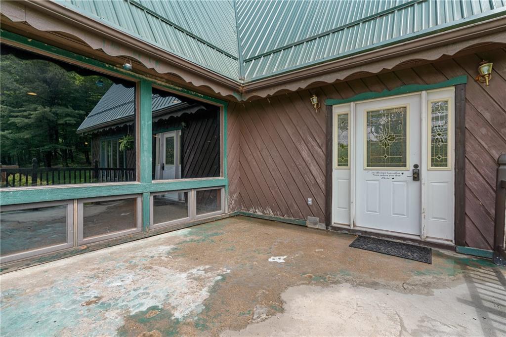 144 Church Road Rural Valley, PA 16249 - Photo 26 of 33 a view of backyard with large trees and a wooden deck