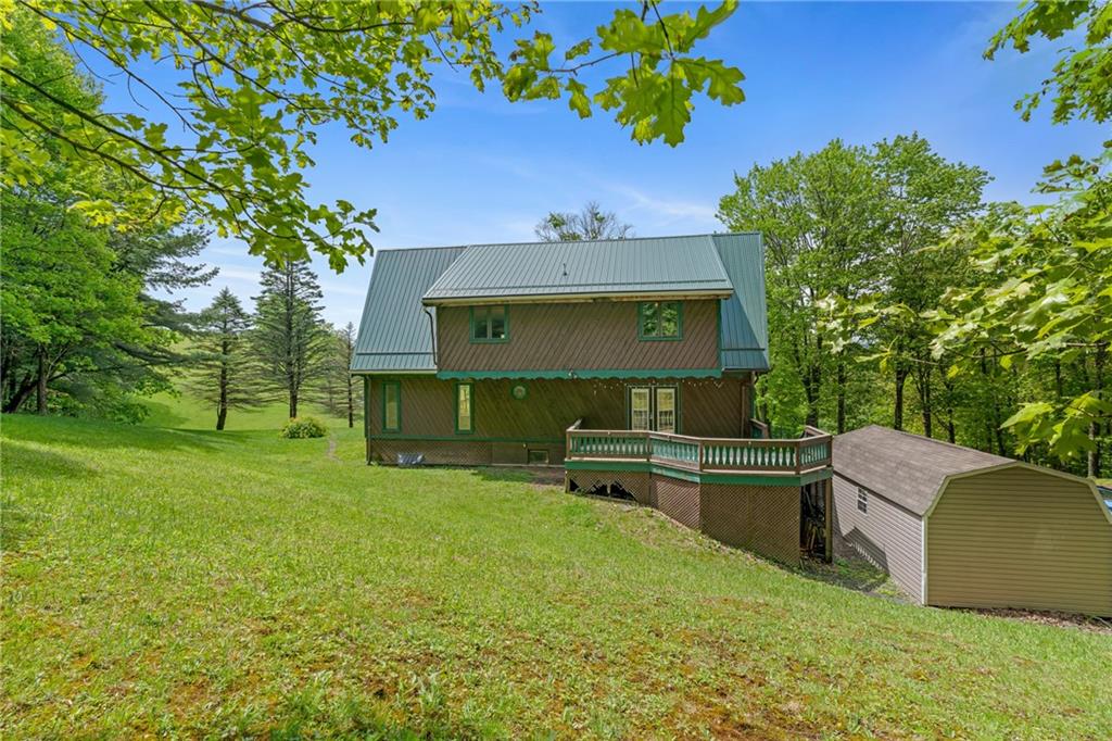 144 Church Road Rural Valley, PA 16249 - Photo 27 of 33 a front view of a house with a garden and sitting area