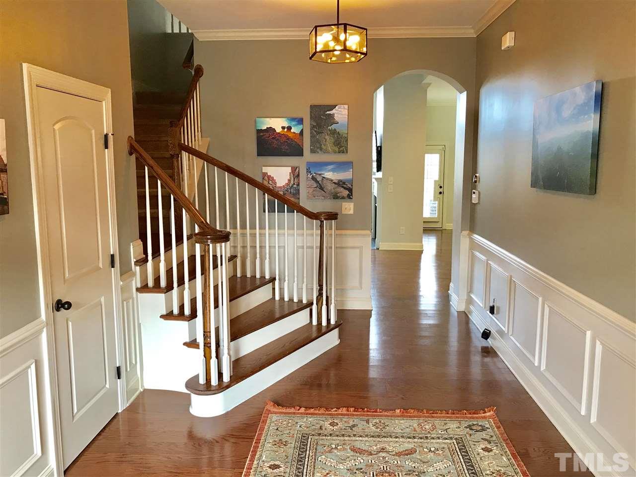 840 Historian Street Raleigh, NC 27603 - Photo 2 of 25 a view of staircase with railing and a chandelier