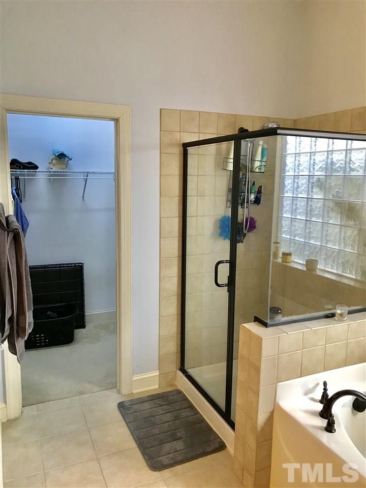 840 Historian Street Raleigh, NC 27603 - Photo 11 of 25 a bathroom with a bathtub and a shower