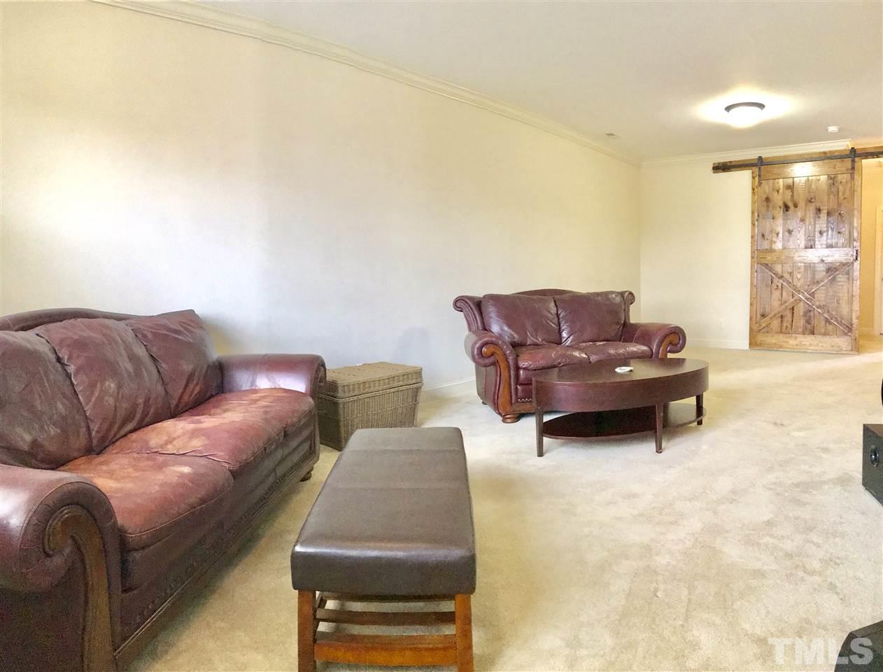 840 Historian Street Raleigh, NC 27603 - Photo 15 of 25 a living room with furniture and a couch