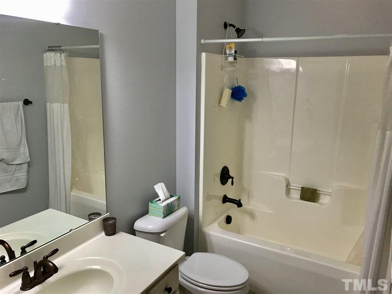 840 Historian Street Raleigh, NC 27603 - Photo 17 of 25 a bathroom with a sink toilet and shower