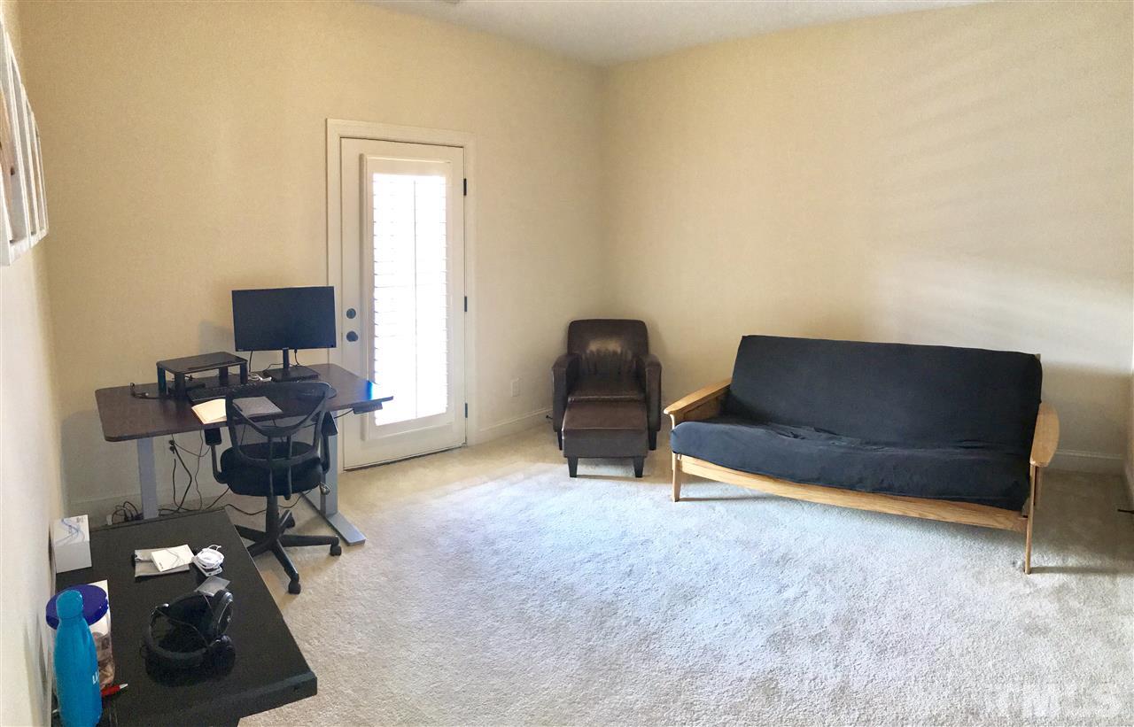 840 Historian Street Raleigh, NC 27603 - Photo 18 of 25 a living room with furniture and a flat screen tv