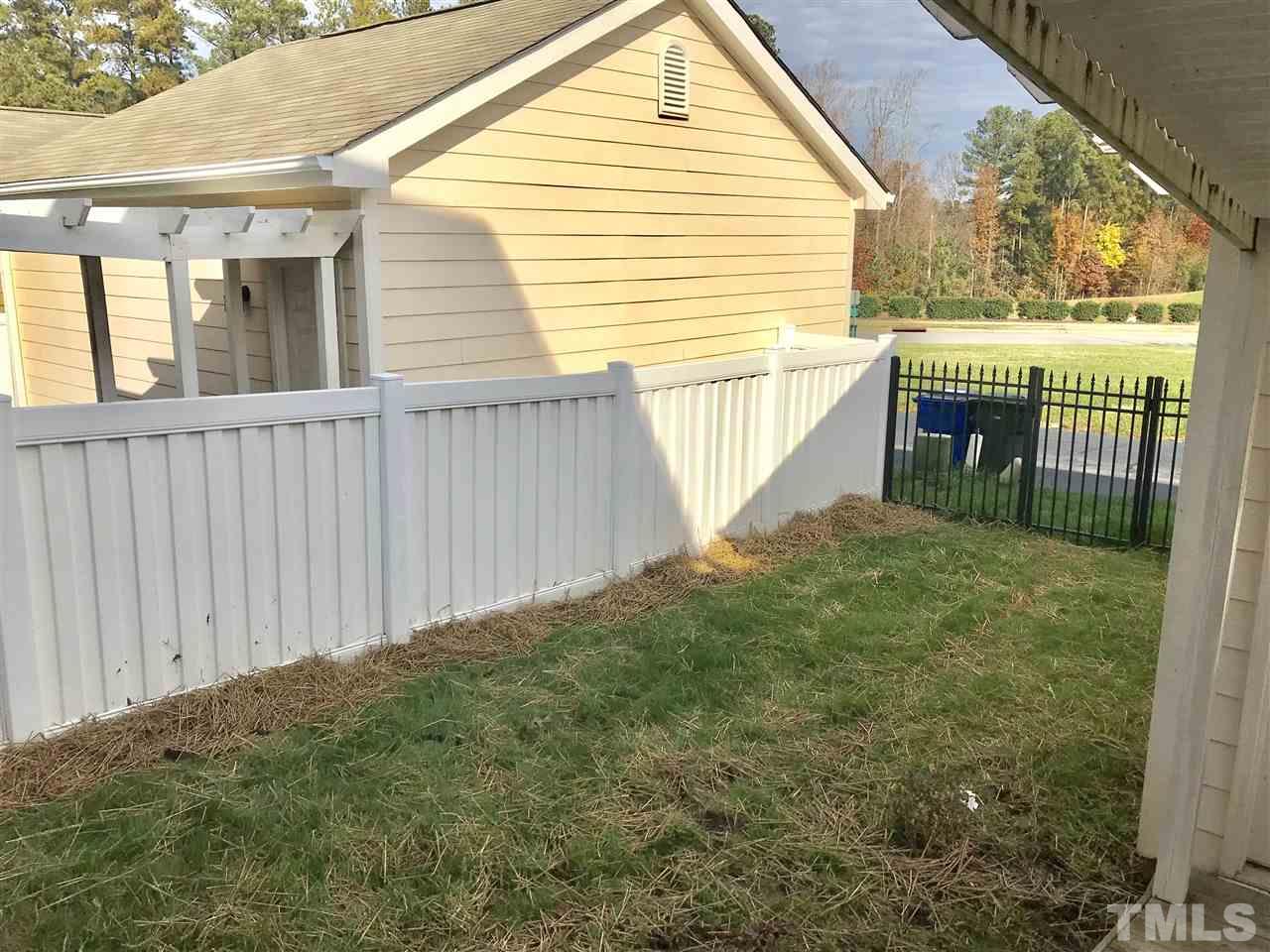 840 Historian Street Raleigh, NC 27603 - Photo 22 of 25 a view of backyard with deck and outdoor seating