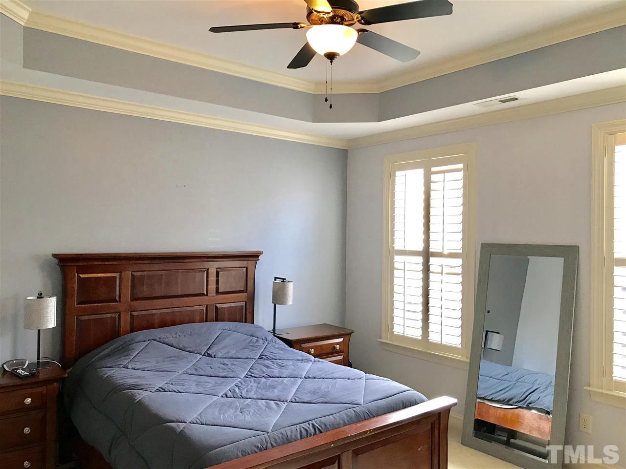 840 Historian Street Raleigh, NC 27603 - Photo 8 of 25 a bedroom with a bed and a window