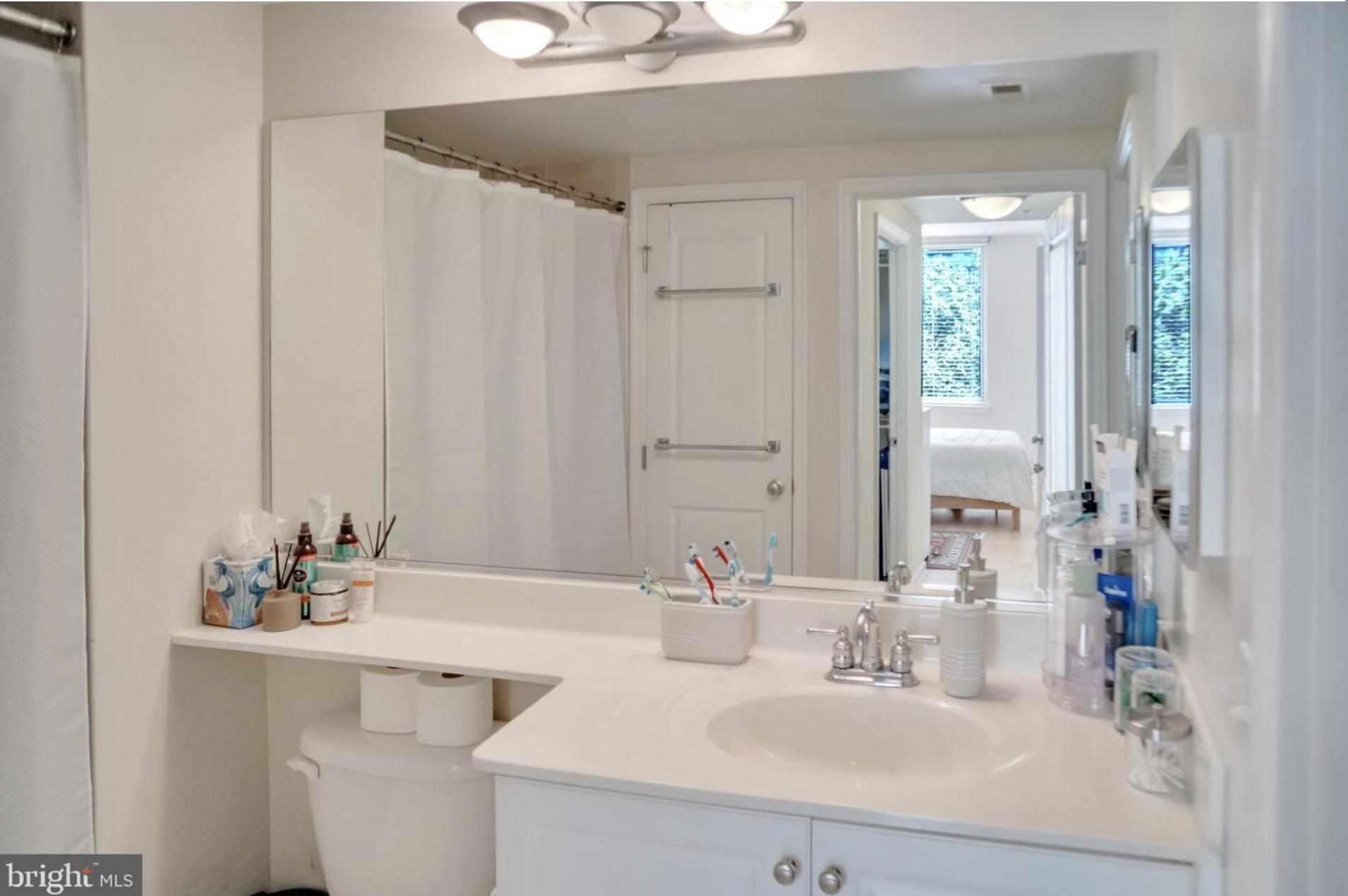 851 North Glebe Road, Unit 402 Arlington, VA 22203 - Photo 11 of 16 light, bright bathroom + linen closet