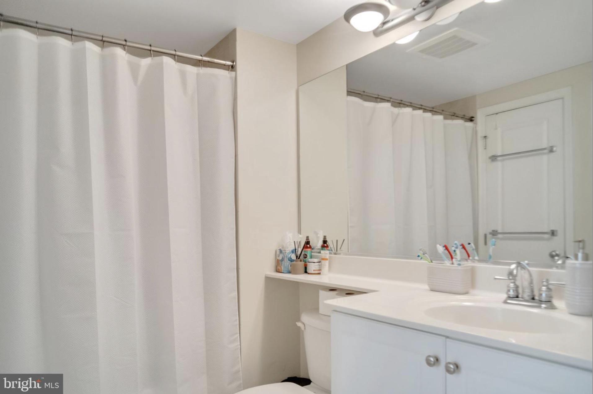 851 North Glebe Road, Unit 402 Arlington, VA 22203 - Photo 10 of 16 bathroom opens to bedroom and living area
