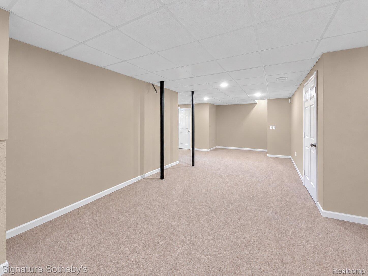170 Fairhill Way Howell, MI 48843 - Photo 39 of 60 Lower-level daylight basement family/recreation room with recessed lighting and drop ceiling