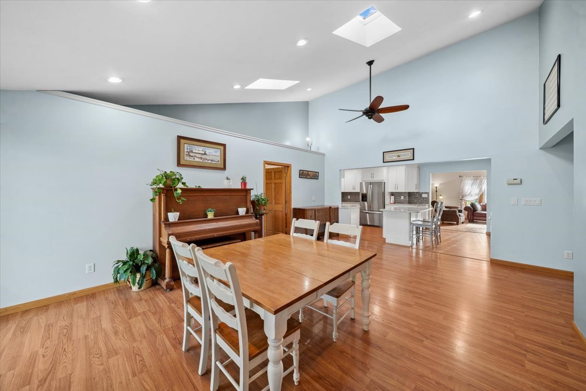 2 Division Street Bristol, IL 60512 - Photo 11 of 44 a living room with dining room and wooden floor