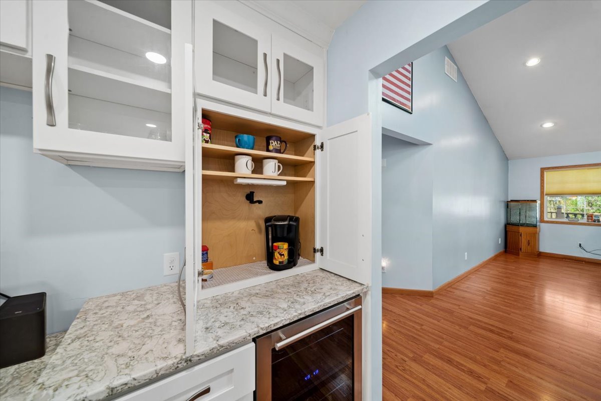 2 Division Street Bristol, IL 60512 - Photo 13 of 44 a kitchen with granite countertop stainless steel appliances and wooden floor