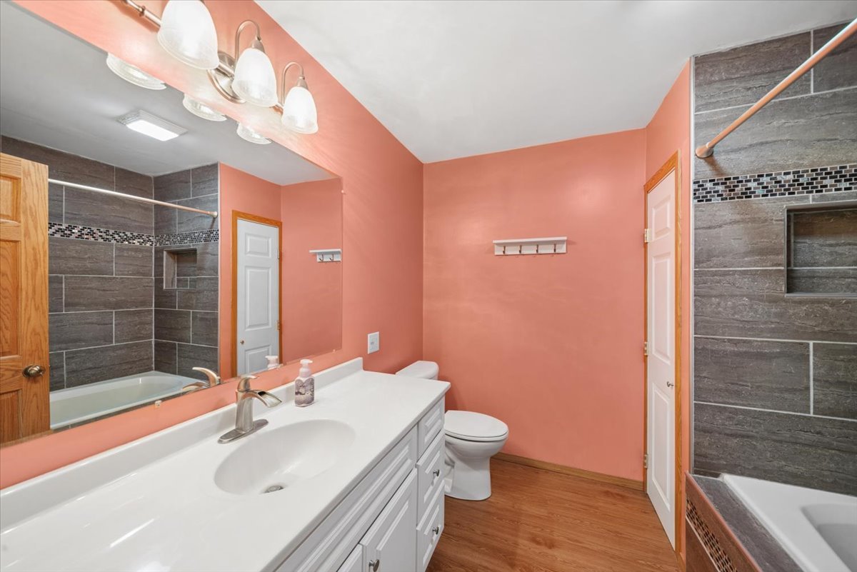 2 Division Street Bristol, IL 60512 - Photo 20 of 44 a bathroom with a sink a toilet and shower