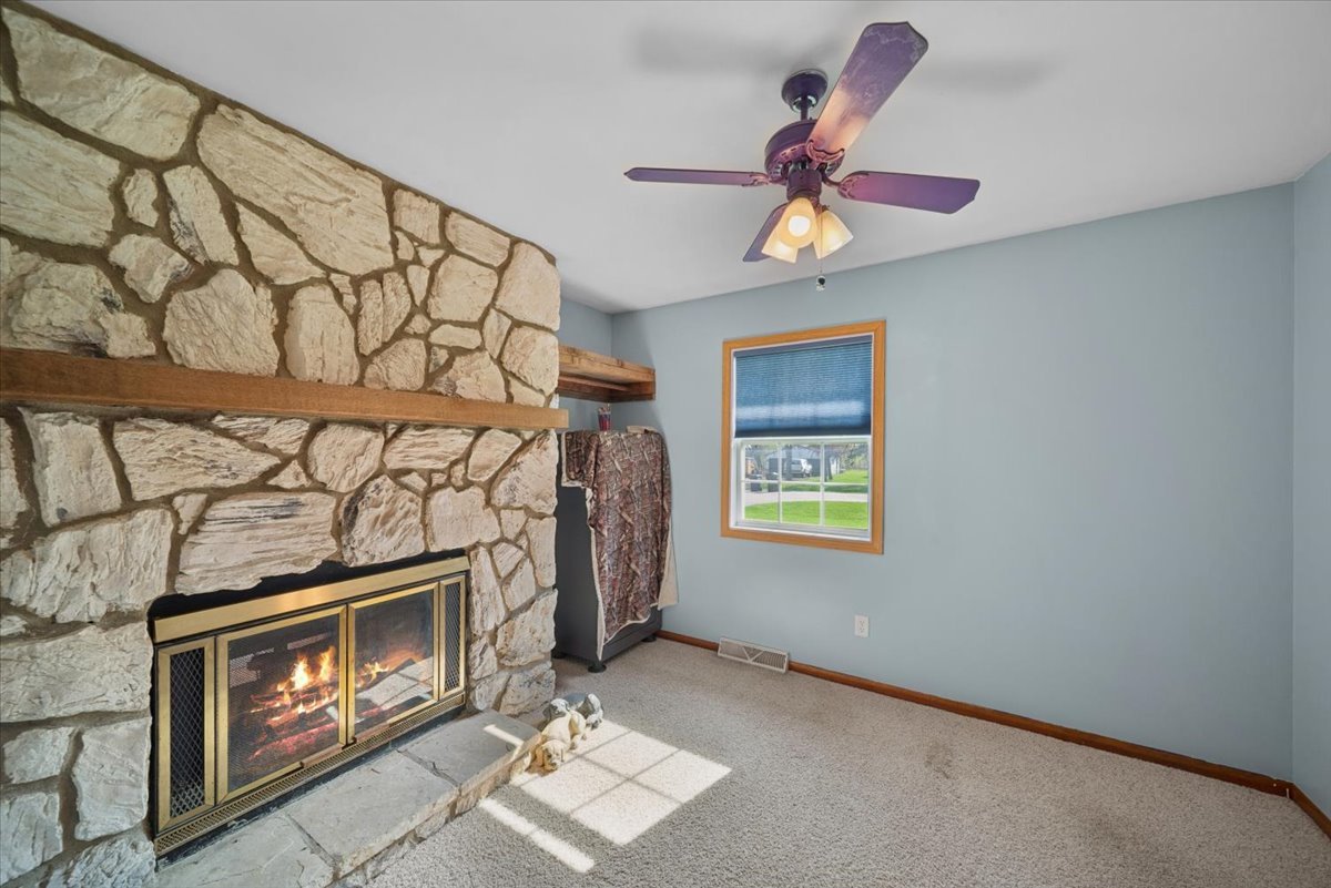 2 Division Street Bristol, IL 60512 - Photo 21 of 44 a living room with a fireplace