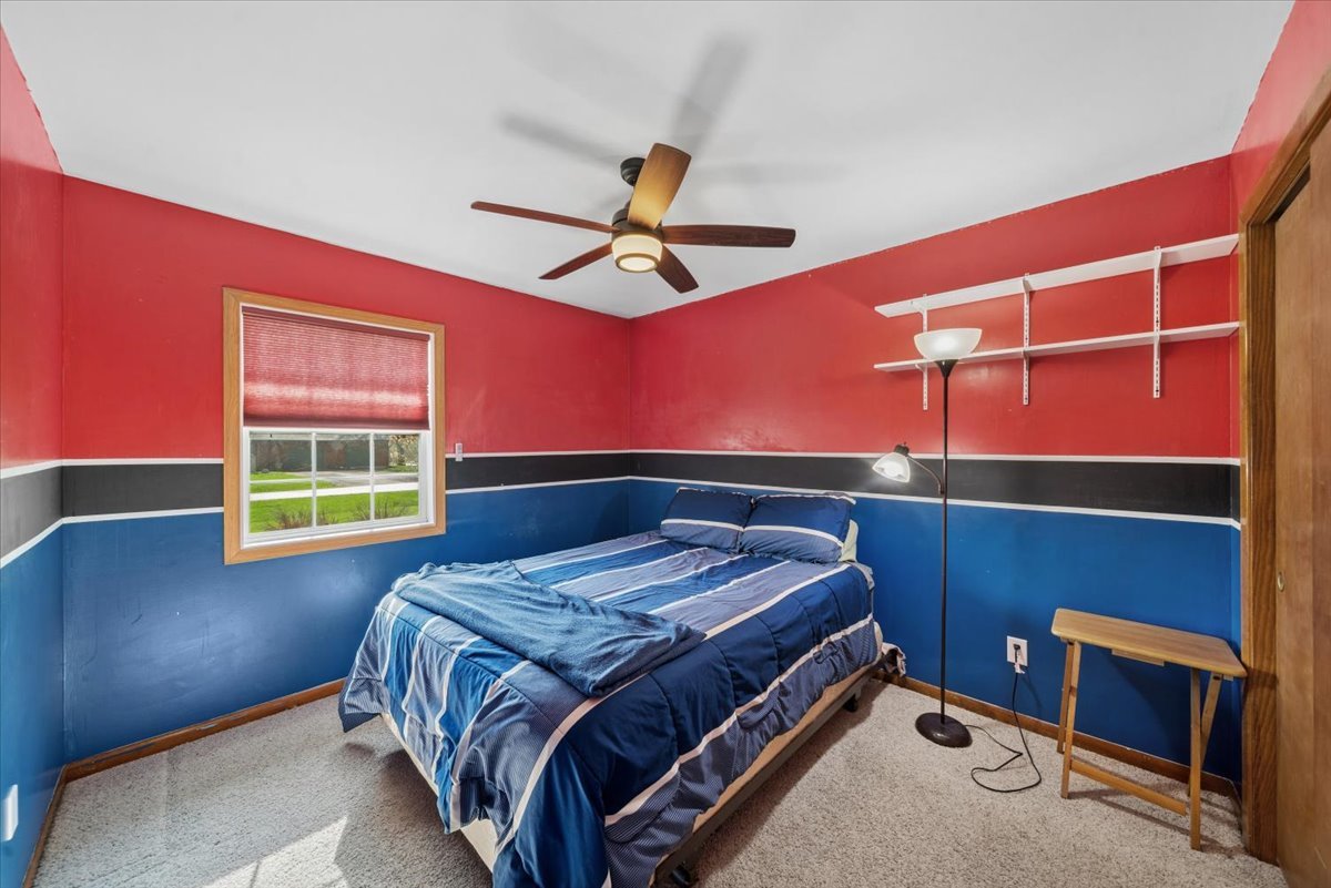 2 Division Street Bristol, IL 60512 - Photo 22 of 44 a bedroom with a bed and a window