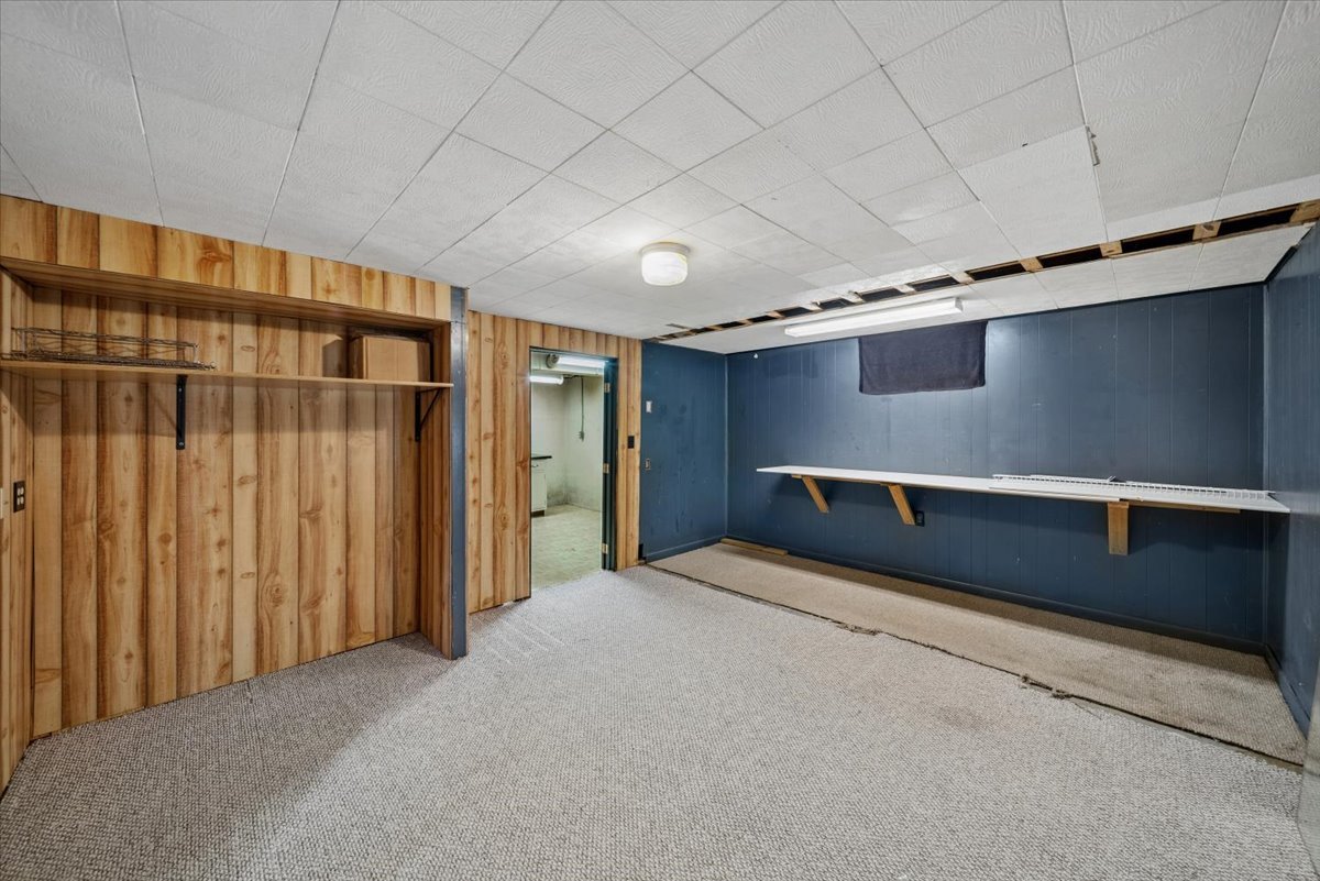 2 Division Street Bristol, IL 60512 - Photo 31 of 44 a large room with a large bed