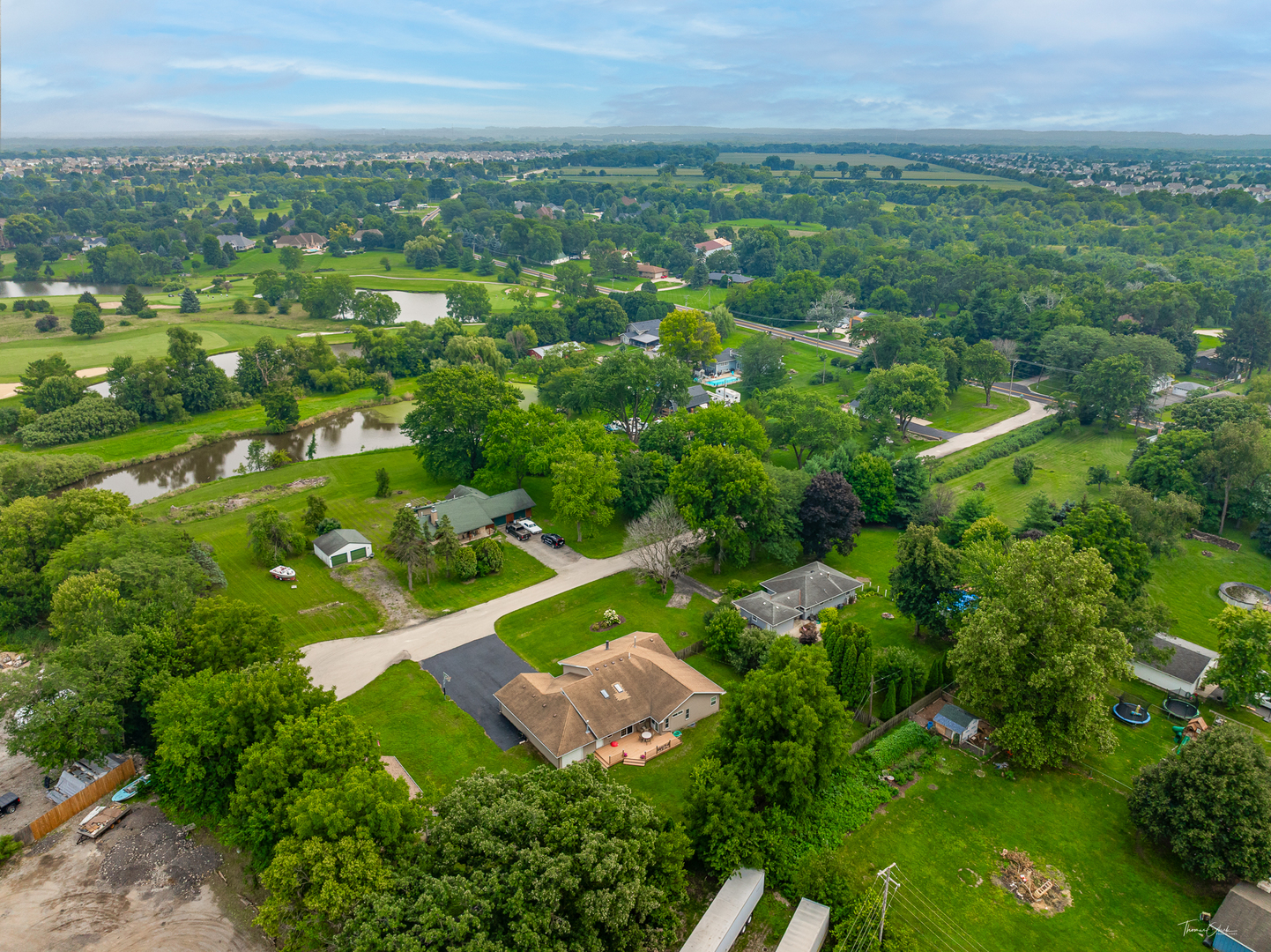 2 Division Street Bristol, IL 60512 - Photo 44 of 44 an aerial view of residential houses with outdoor space and trees