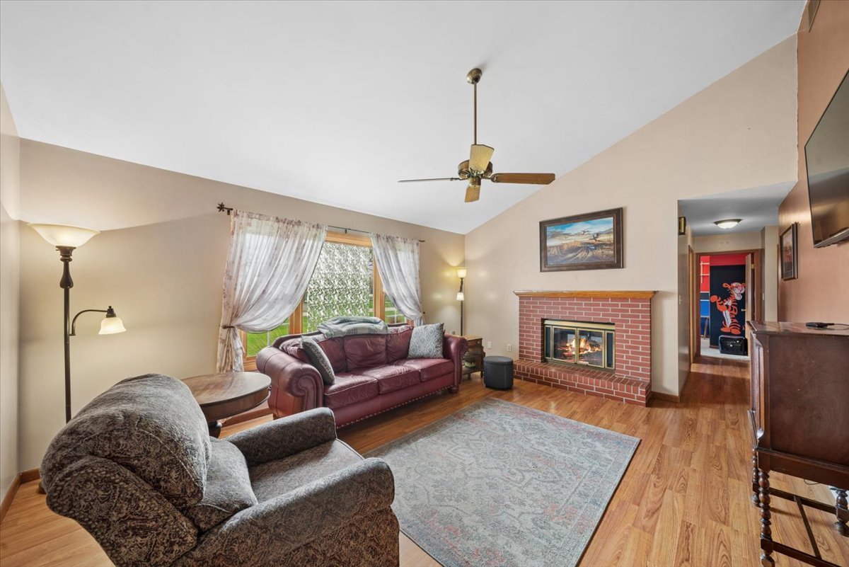 2 Division Street Bristol, IL 60512 - Photo 6 of 44 a living room with furniture and a fireplace