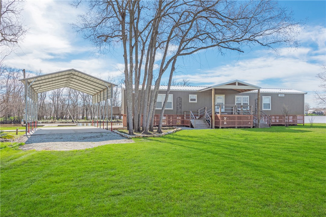 a front view of a house with garden and porch