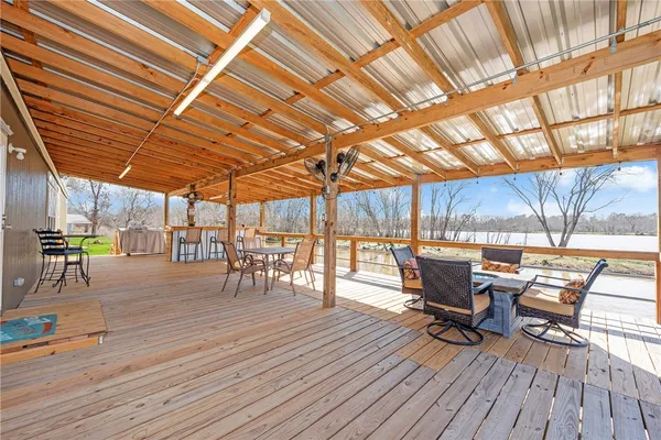 a patio with wooden cabinets and outdoor seating