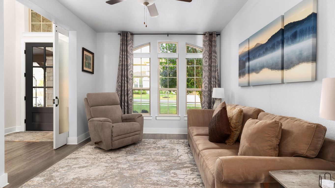1925 Sorvino Walk Leander, TX 78641 - Photo 19 of 36 a living room with furniture and a large window