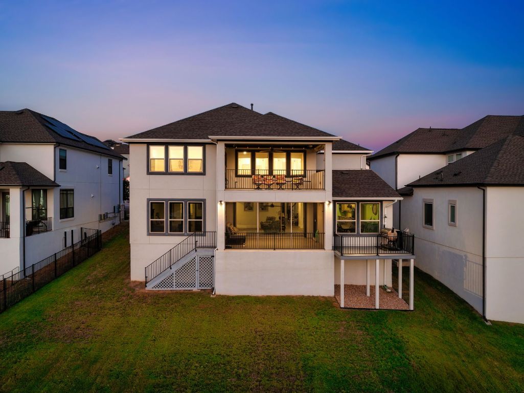1925 Sorvino Walk Leander, TX 78641 - Photo 31 of 36 a front view of a house with a yard table and chairs