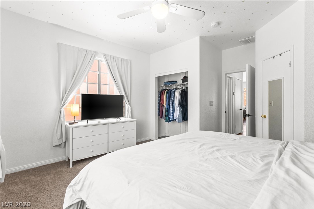 7353 Ridge Star Court Las Vegas, NV 89131 - Photo 30 of 36 Well-lit bedroom features ample natural light and a convenient built-in closet.