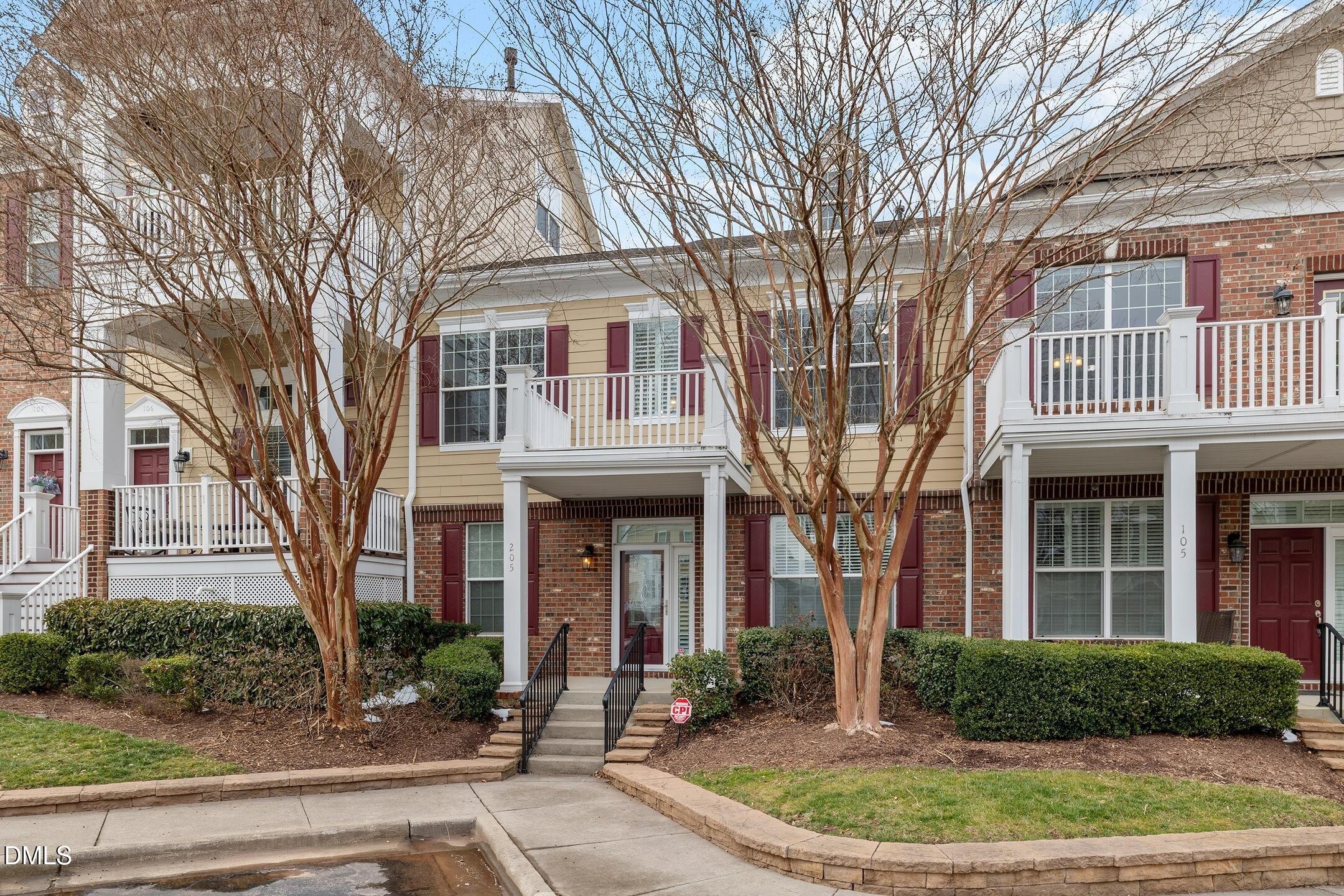9211 Calabria Drive, Unit 205 Raleigh, NC 27617 - Photo 55 of 55 front view of a brick house with a yard