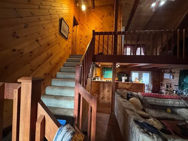a dining room with furniture window and wooden floor