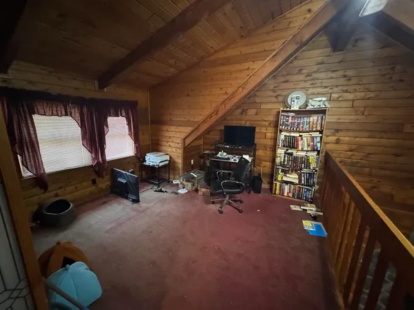 a bedroom with bed and a window